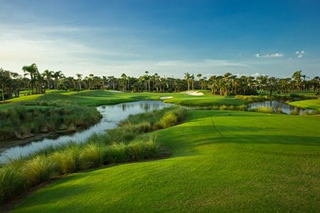 The lush green grass and landscaping of Orchid Island Golf Course