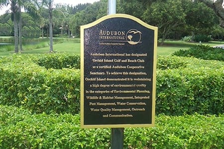 Audubon International plaque awarded to Orchid Island, signifying the club's environmental stewardship and Audubon certification.