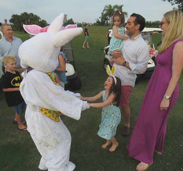 Easter bunny greeting children at Orchid Island Easter celebration
