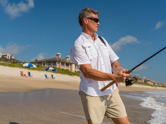 Man fishing in the ocean at Orchid Island Golf &amp; Beach Resort