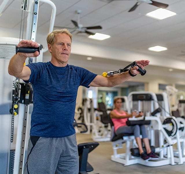 Man works out at the Orchid Island Fitness Center