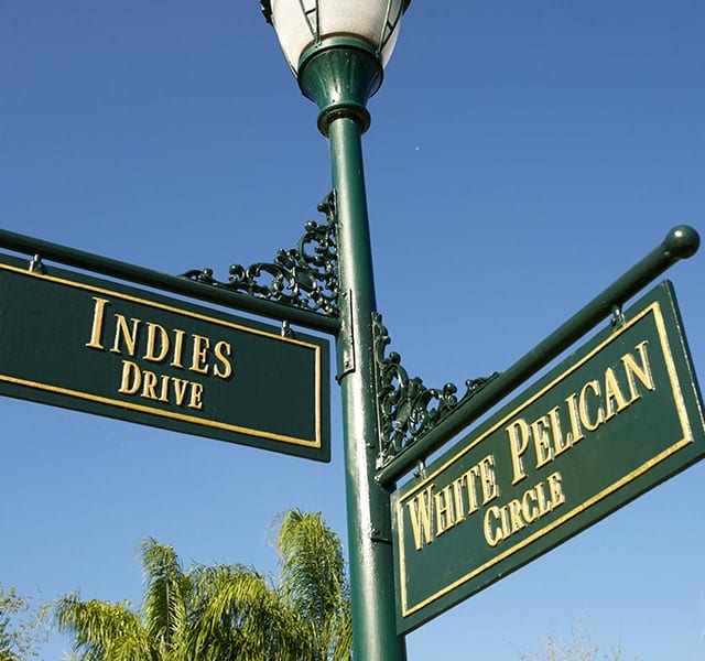 Gold and Green Street Sign at Orchid Island showing the intersection of 