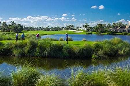 4 golfers tee-off on one of the holes at Orchid Island's Arnold Palmer Golf Course