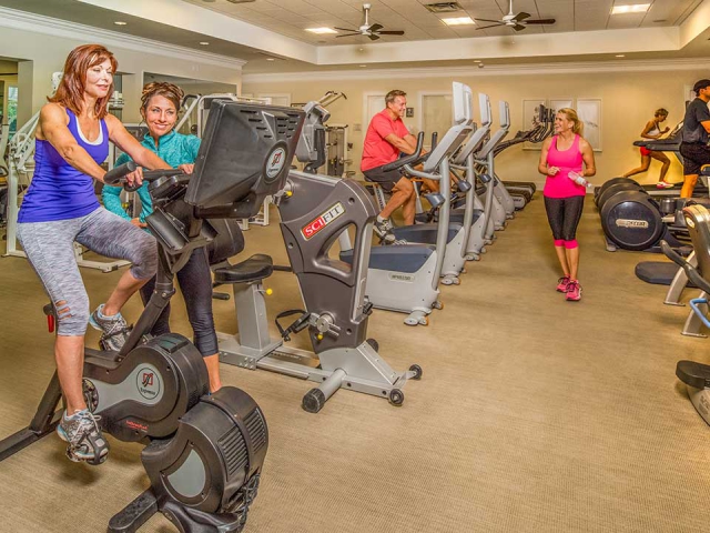 Members exercising on machines at Orchid Island Fitness Center