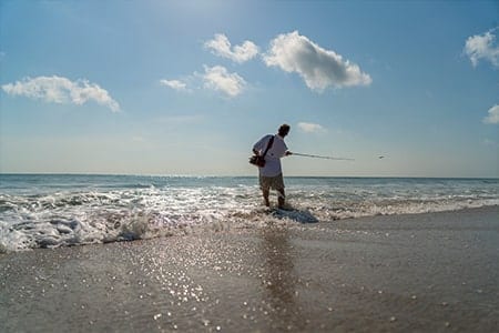 Man Fishing in the surf on Orchid Island's Beach