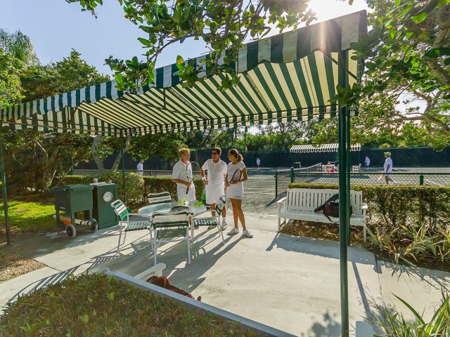 Friends talking at Orchid Island Tennis Club