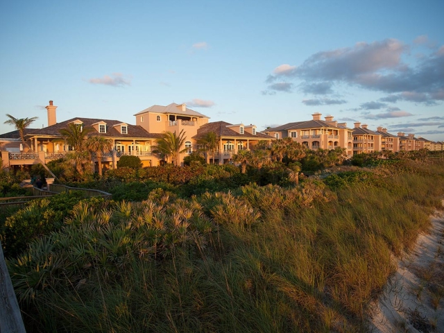 Orchid Island Sand Dunes and Boardwalk to the Beach with oceanfront condos in the background