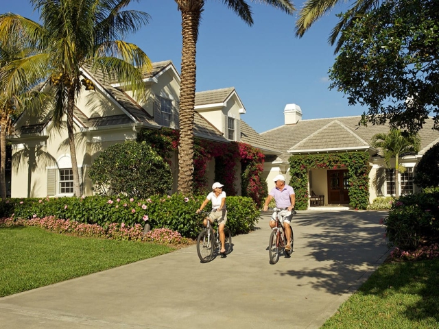 Older couple riding bikes at Orchid Island