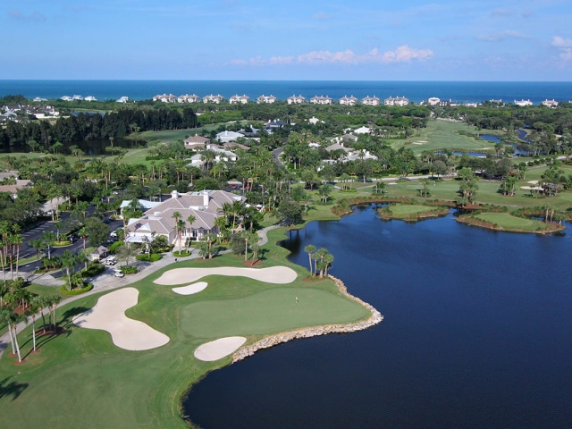 Orchid Island Golf Course Hole 18 with clubhouse behind it