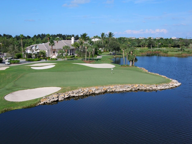 Orchid Island Golf Course Hole 18 green with the clubhouse behind it