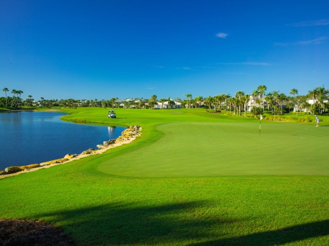 Golfers on the green at Orchid Island Golf Course