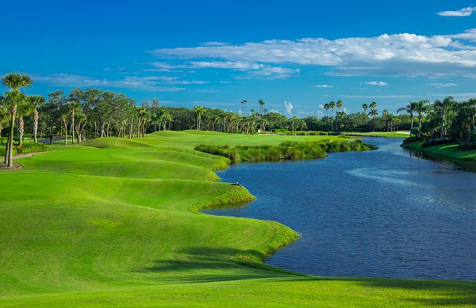Undulating fairway and water feature of Orchid Island Golf Club Hole 16