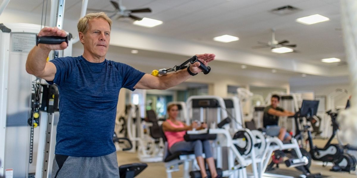 man on fitness equipment at orchid