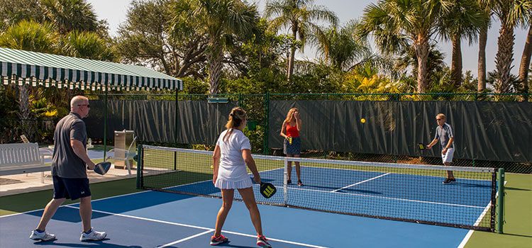 Orchid Island Members playing tennis at one of the best Florida tennis Communities