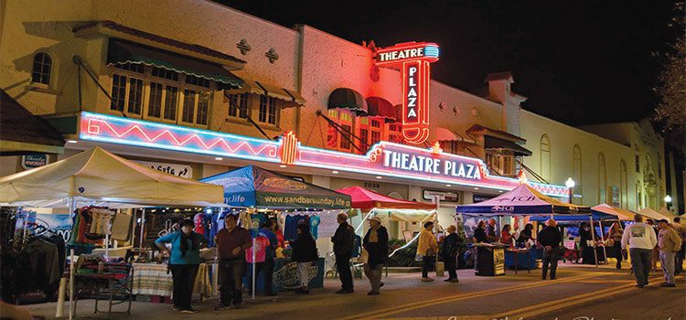 Downtown Vero Beach at night featuring vendors