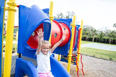 girl playing on Playground at Orchid Island