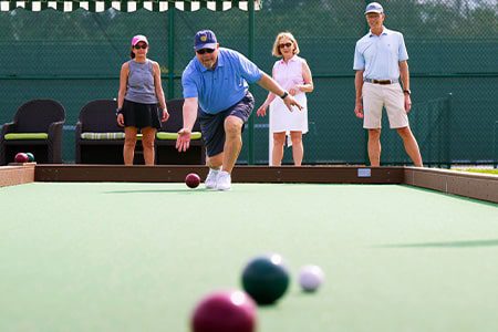 Orchid Island members playing Bocce Ball