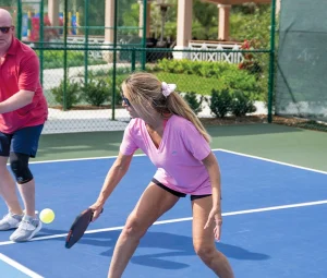 Members playing pickleball at Orchid Island’s private Florida club