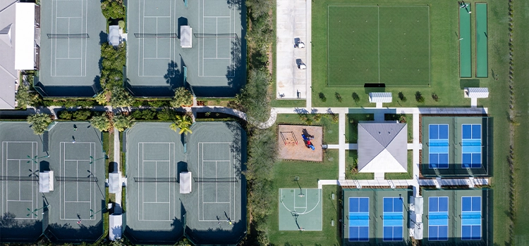 Aerial view of Orchid Island’s sports complex with tennis and pickleball courts