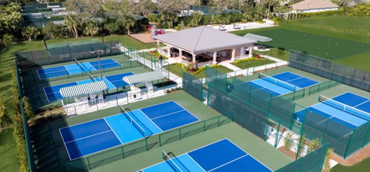 Aerial view of multiple blue and green pickleball courts