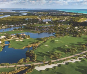Aerial view of coastal residential community with waterways and shoreline